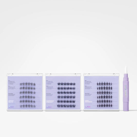 Three rows of false eyelash clusters in different lengths, displayed alongside a lavender applicator wand on a clean white background.
