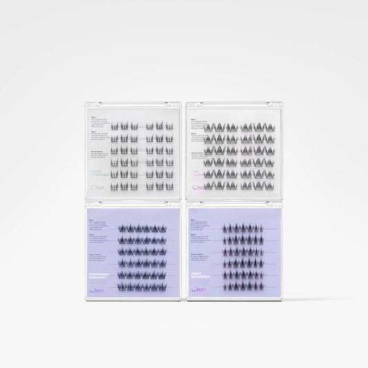 Four clear plastic trays containing multiple rows of black eyelash extensions, arranged in a 2x2 grid on a light gray background.