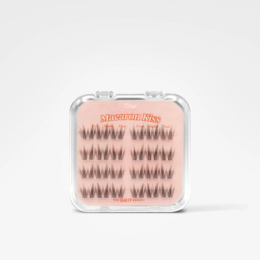 A package of false eyelashes on a light pink backing card inside a clear plastic case, photographed against a clean white background.
