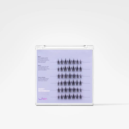 A clear plastic tray containing multiple rows of small black false eyelash clusters on a light lavender insert card with printed instructions and the brand name 'char'.