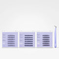 Three clear plastic lash extension trays filled with black false eyelash clusters, shown on a white background with a lavender tweezers tool standing to the right. The trays have a light lavender/purple tint.