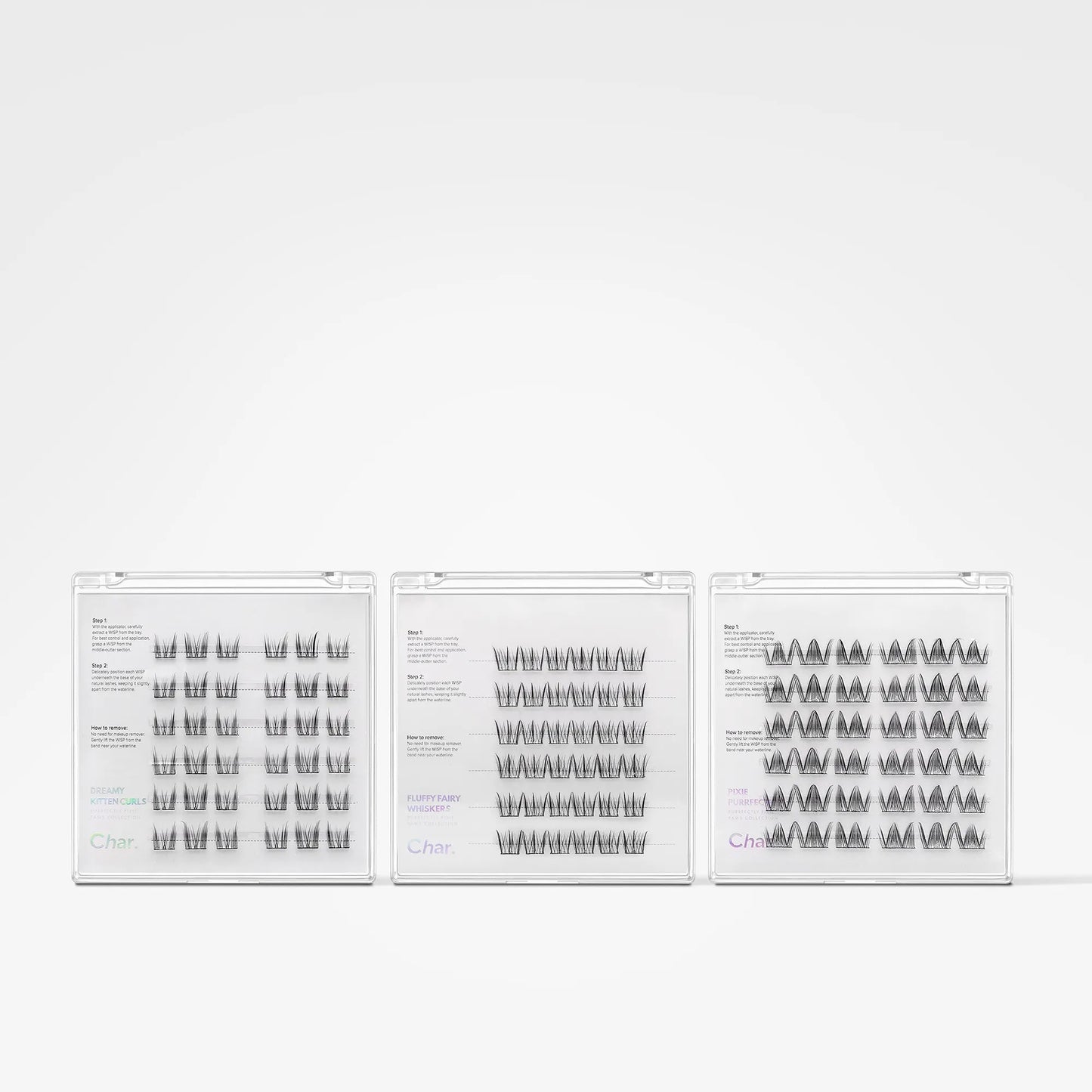 Three clear plastic trays of false eyelashes arranged side by side on a plain white background. The lashes are black and arranged in different patterns: vertical, wavy, and layered.