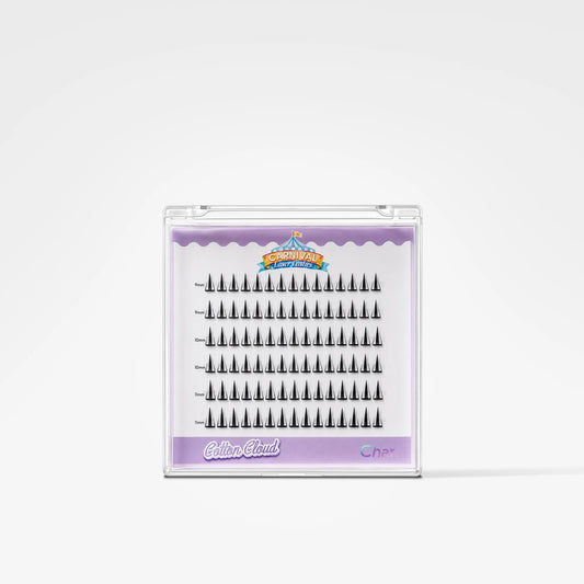 A package of black false eyelashes in a clear plastic case with a lavender and white insert. The brand name 'CinemaBlind' is visible on the packaging.
