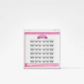 A clear plastic clamshell package containing multiple pairs of black false eyelashes on a white card with pink branding, photographed on a clean white background.