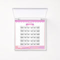 A clear plastic clamshell case containing 20 pairs of black false eyelashes on a white card with pink decorative borders and the brand name 'Fairyground Fairy' visible.