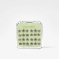A clear plastic clamshell case containing multiple pairs of dark eyelash extensions arranged on a pale green insert card. The card shows the brand name 'Cute' and the product name 'berryBlink'.