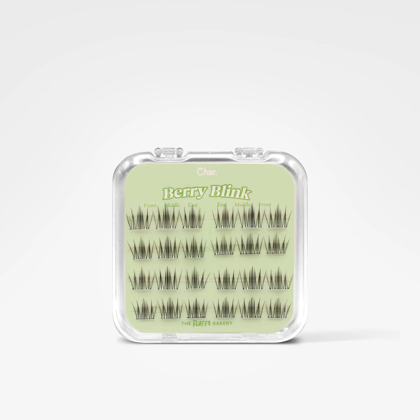 A clear plastic clamshell case containing multiple pairs of dark eyelash extensions arranged on a pale green insert card. The card shows the brand name 'Cute' and the product name 'berryBlink'.