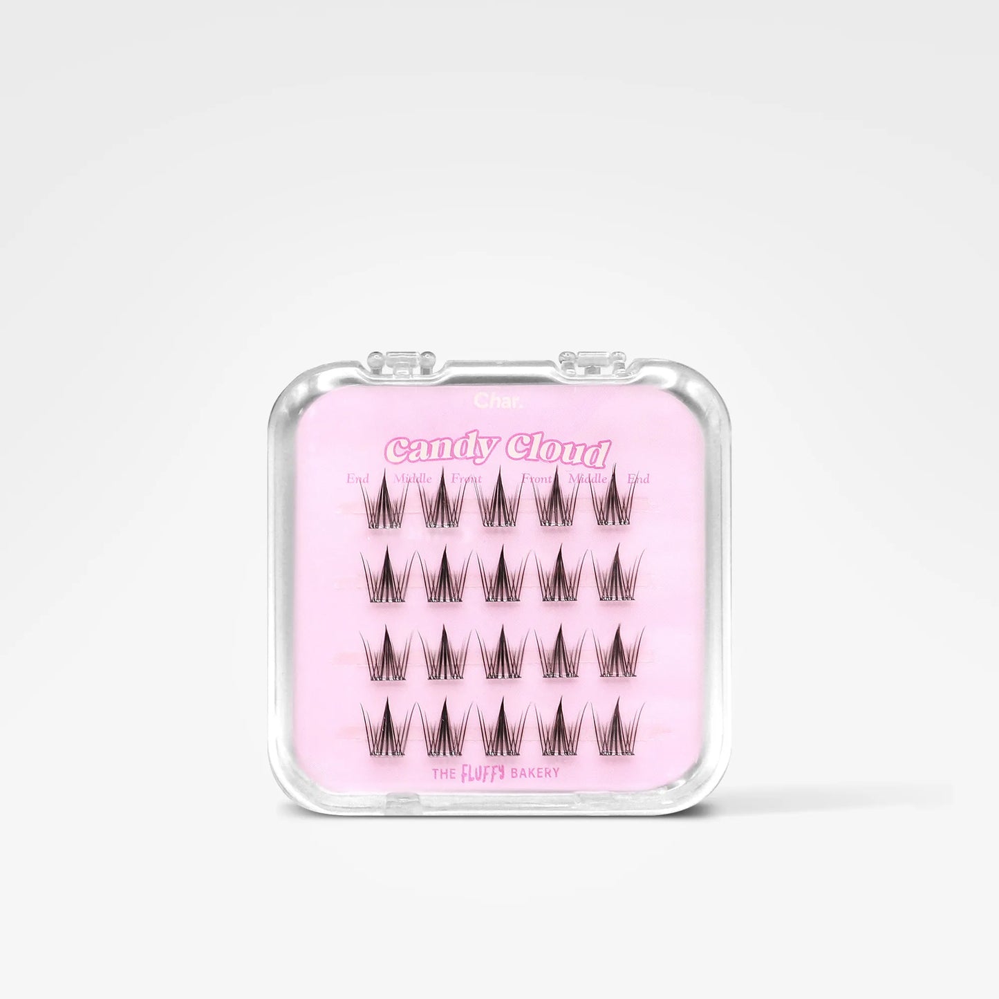 A clear plastic case containing false eyelashes on a light pink card labeled 'Candy Cloud' and 'The Luvy Baggage', shown on a clean white background.