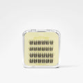 A small clear plastic case containing multiple pairs of black false eyelashes on a pale yellow insert, photographed on a clean white background. The insert shows the brand name 'Blinky Pets'.