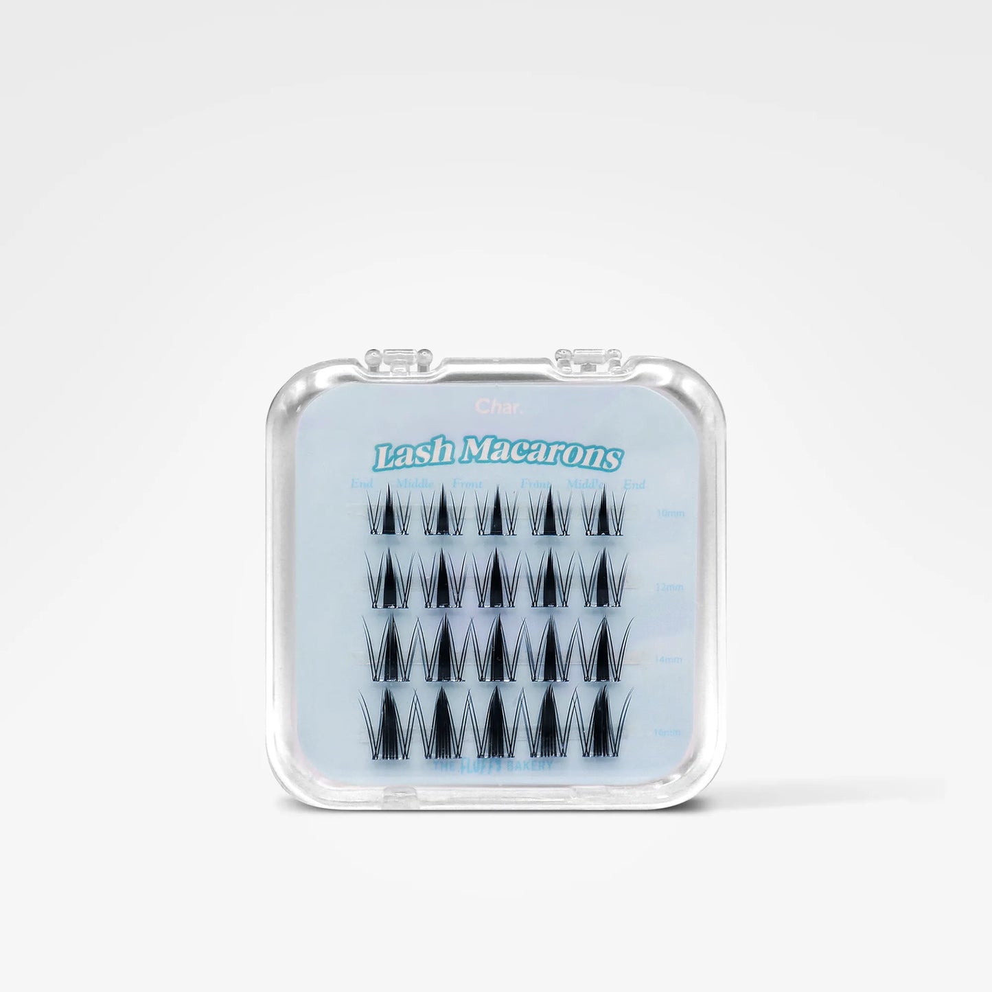 A small clear plastic case containing black lash macrons false eyelash clusters, shown on a clean white background. The front of the case has a light blue insert with the text 'Lash Macrons' in blue.
