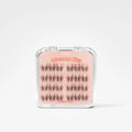 A package of false eyelashes on a light pink backing card inside a clear plastic case, photographed against a clean white background.