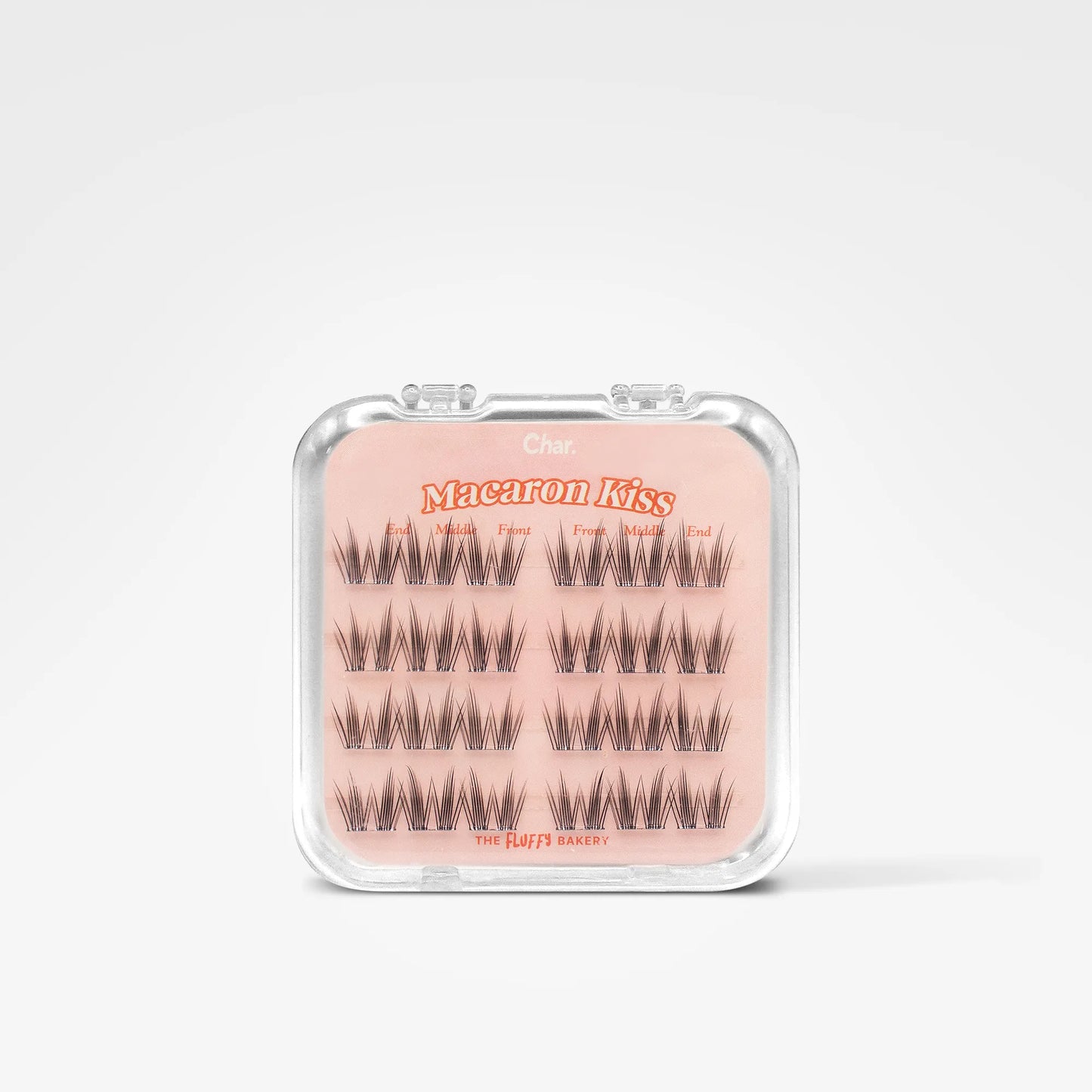 A package of false eyelashes on a light pink backing card inside a clear plastic case, photographed against a clean white background.