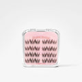 A clear plastic clamshell case containing three rows of black eyelash clusters on a pink backing card. The card reads 'Pastel Flute' and 'The Hair's Axxessy'.