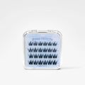 A clear plastic clamshell case containing five pairs of black false eyelashes on a light blue backing card labeled 'Sweet Whispers' and 'The Beauty Bank.'.