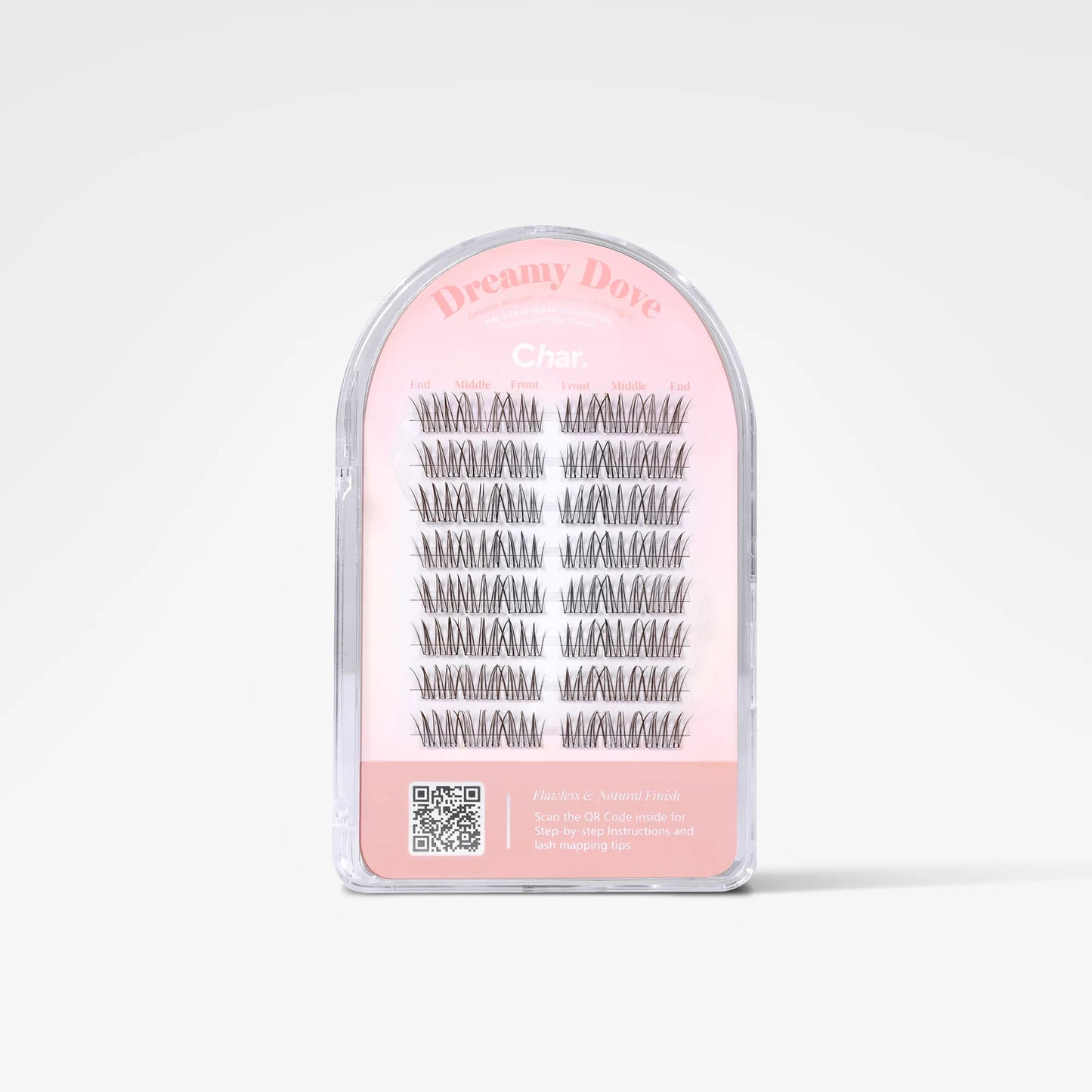 A clear plastic arch-shaped package containing multiple pairs of black false eyelashes on a pink backing card. The card reads 'Dreamy Dove' and 'Char.