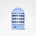 A package of Feather Flare false eyelashes in the shade Charcoal, shown in a clear plastic arch-shaped case with a light blue label.