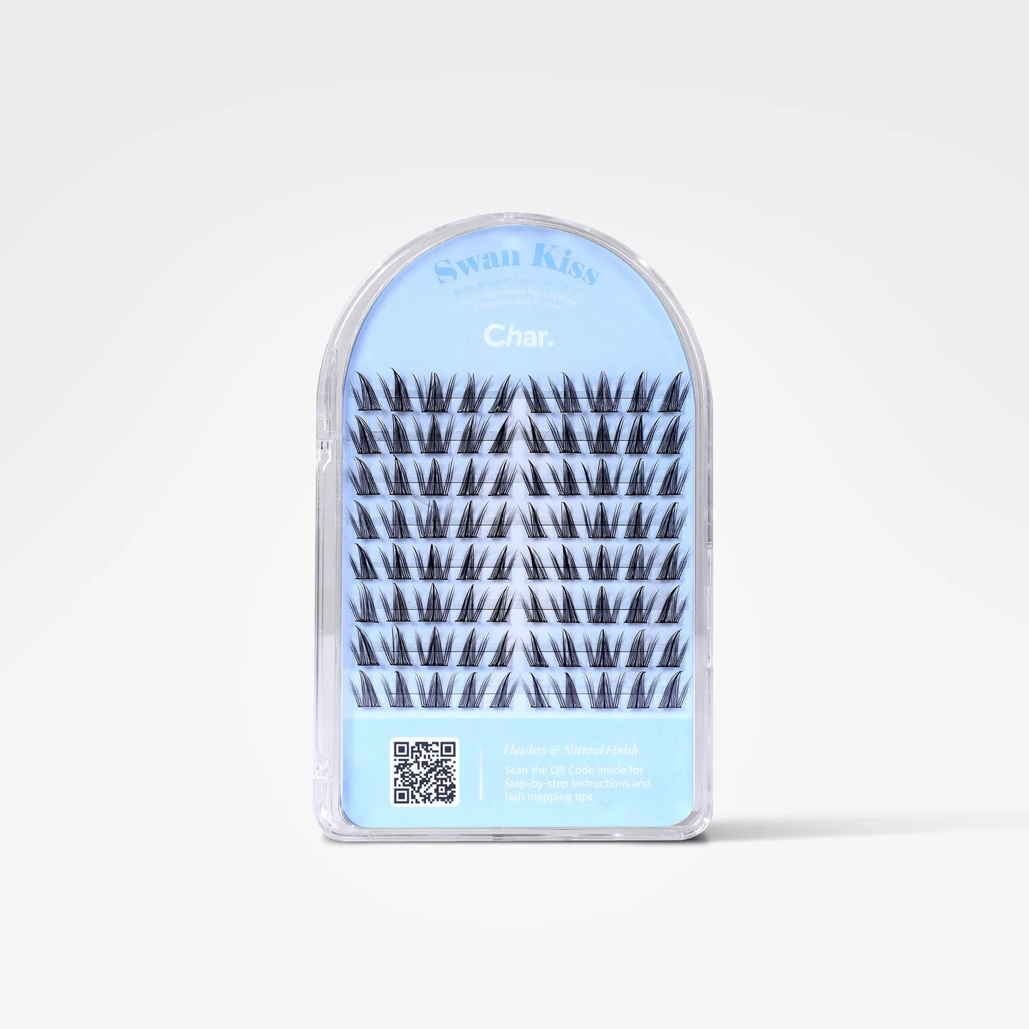 A package of false eyelashes in an arched clear plastic case with a light blue insert. The lashes are black, and the packaging features the brand name 'Swan Kiss' and the shade name 'Char.