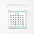 A clear plastic clamshell case containing rows of black false eyelash clusters on a white backing card. The card has pastel blue and pink decorative borders and visible text including 'Starry Glitter' and 'Char'.